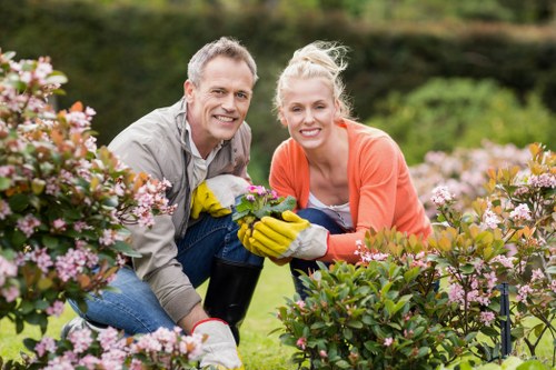 Happy homeowner with a cleared garden
